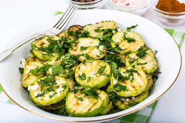 Fried zucchini with herbs and garlic