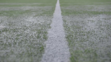 Rain on a soccer camp

Rain shooting of a football field