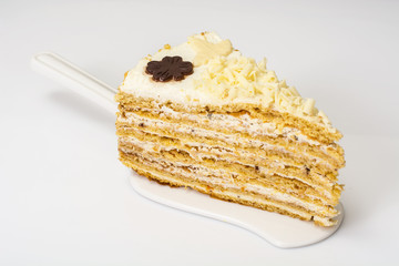 Honey cake with whipped cream and white chocolate