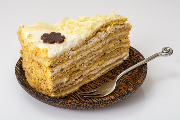 Honey cake with whipped cream and white chocolate