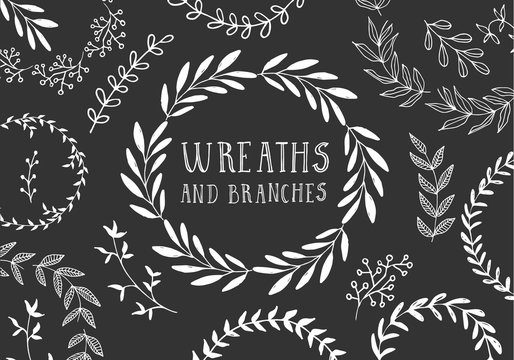 White hand drawn wreaths and branches. Ink and brush vector illustration. Isolated