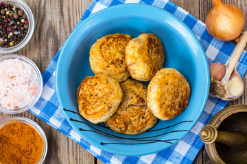 Cutlets in a ceramic bowl