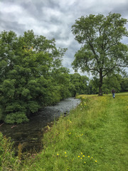 Man walking on Pennine Way near brook