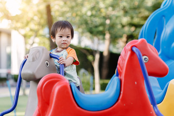 Fototapeta na wymiar Little boy playing fun at Playground