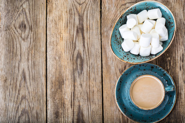 Obraz na płótnie Canvas White marshmallow and coffee with milk