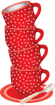 Stack of red tea cups with hearts and spoon
