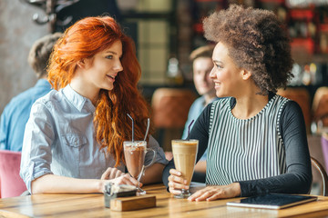 Friends having a great time in the cafe