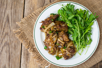 Calf's liver with arugula garnish