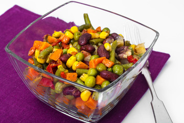 Stewed vegetables in a glass salad bowl