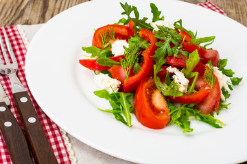 Vegetable salad with arugula and goat cheese