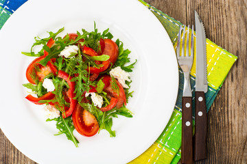 Vegetable salad with arugula and goat cheese