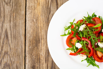 Vegetable salad with arugula and goat cheese