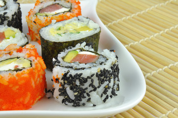 Sushi mix on white plate