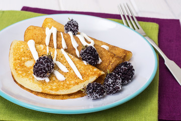 Pancake thin fried with blackberry