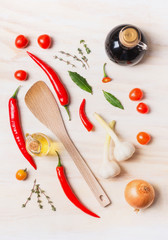 Spices and oil selection with cooking spoon on white wooden background, top view, flat lay. Healthy food concept