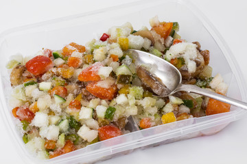Frozen vegetables in a plastic container
