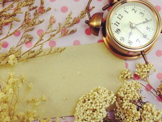 clock with space backgroun with dried flower decorate