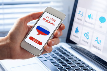 Learn Russian language online concept, mobile phone, flag of Russia