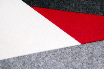 Colorful felt texture for background with copy space. Black, gray, red and white color composition