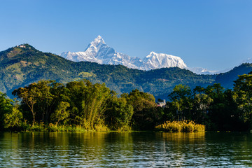 The Machapuchare (left, 6993m) and Annapurna III (right, 7555m) seen from Phewa Lake in Pokhara,...