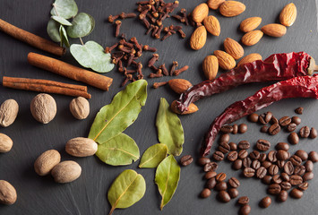 nuts, spices and food on a wooden tray