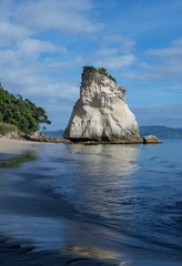 Scenic view of Cathedral Cove-it is a beach on Coromandel Peninsula in New Zealand, named for the arching cave linking Cathedral Cove to Mare's Leg Cove.Sandy wild beach. Cathedral Cove Marine Reserve