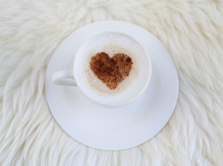Cappuccino with heart pattern of cinnamon