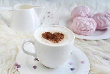 Cappuccino with heart pattern of cinnamon