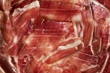 Close-up of best quality sliced prosciutto meat.