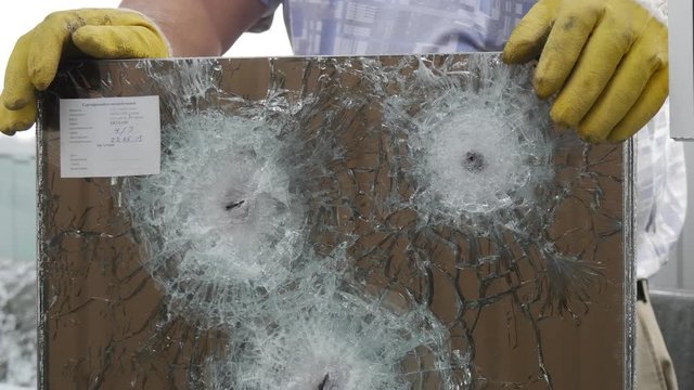 Three Round Cracks and a Lot of Fractures From Bullets Used to Test the Multilayer Bulletproof Glass in Some Laboratoryin Kiev