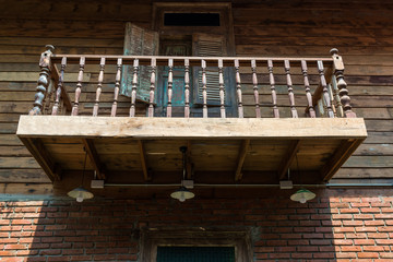 Ancient Terraced wooden house and vintage wall lamp the classic traditional of living in Thailand