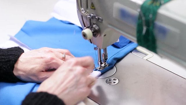 Woman working with sewing machine, Close up HD Clip.