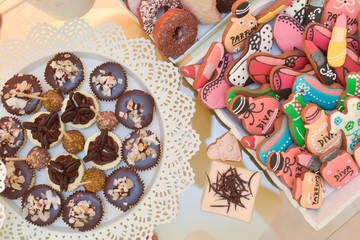 Colourful different shaped gingerbread and chocolate cakes