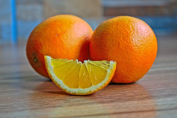Closeup of oranges on a wooden table