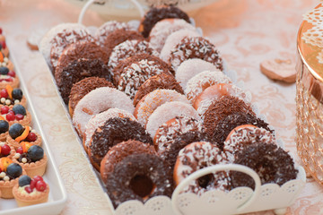 Donuts covered  with white and brown chocolate
