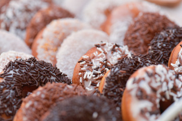 Donuts covered  with white and brown chocolate