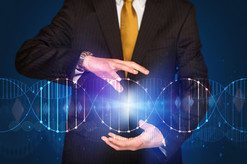 Businessman holding DNA