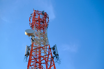 Mobile phone communication antenna tower with the blue sky and c