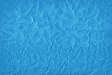 Obraz premium Designed blue background of wrinkled paper