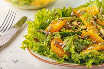 Avocado orange salad with  pumpkin  and sunflower seeds.