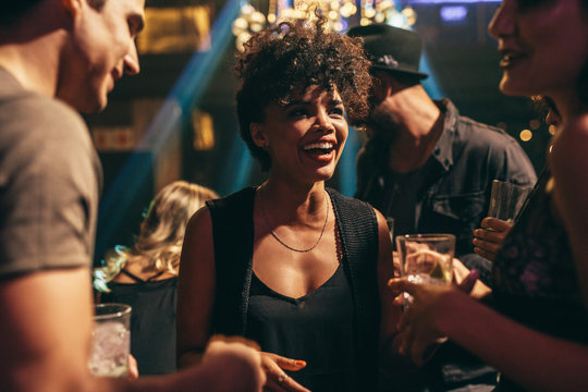 Woman enjoying at nightclub with friends
