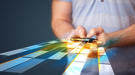 Man holding smartphone with futuristic lines