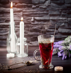 Hibiscus tea in glass Cup on a dark background