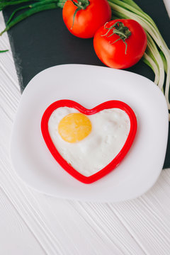 valentine day.romantic breakfast.fried egg and vegetables