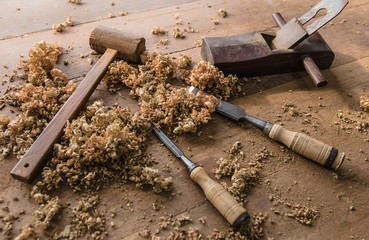 The carpenter was working furniture wood in studio