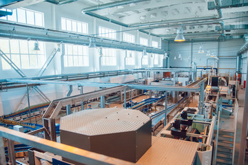 Modern beer plant, with brewing kettles, vessels, tubs and pipes made of stainless steel. Brewery. © kanashkin
