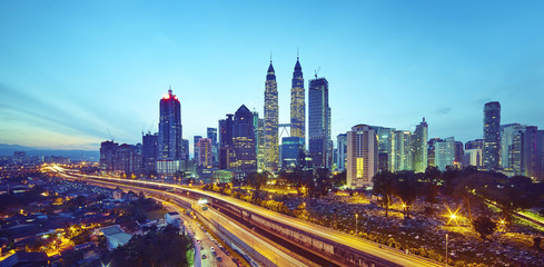 Kuala Lumpur city skyline at twilight, Malaysia .