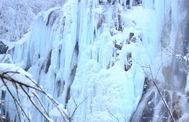 Fototapeta na wymiar Plitvice lakes, World famous National park in Croatia, UNESCO world heritage, frozen waterfalls, cold winter scene