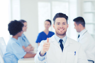 Fototapeta premium happy doctor over group of medics at hospital