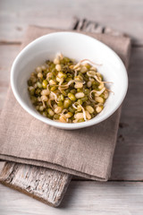 Germinated beans, stand and napkin on the table